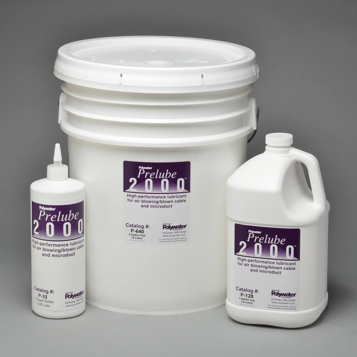 Bucket, gallon jug, and quart squeeze bottle of Polywater Prelube 2000 Winter Grade cable-blowing lubricant displayed together on a gray background
