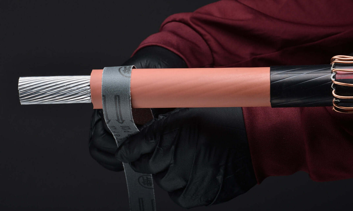 Polywater Splicemaster accessories for cable preparation, featuring precision tools and towels in use on a cable.