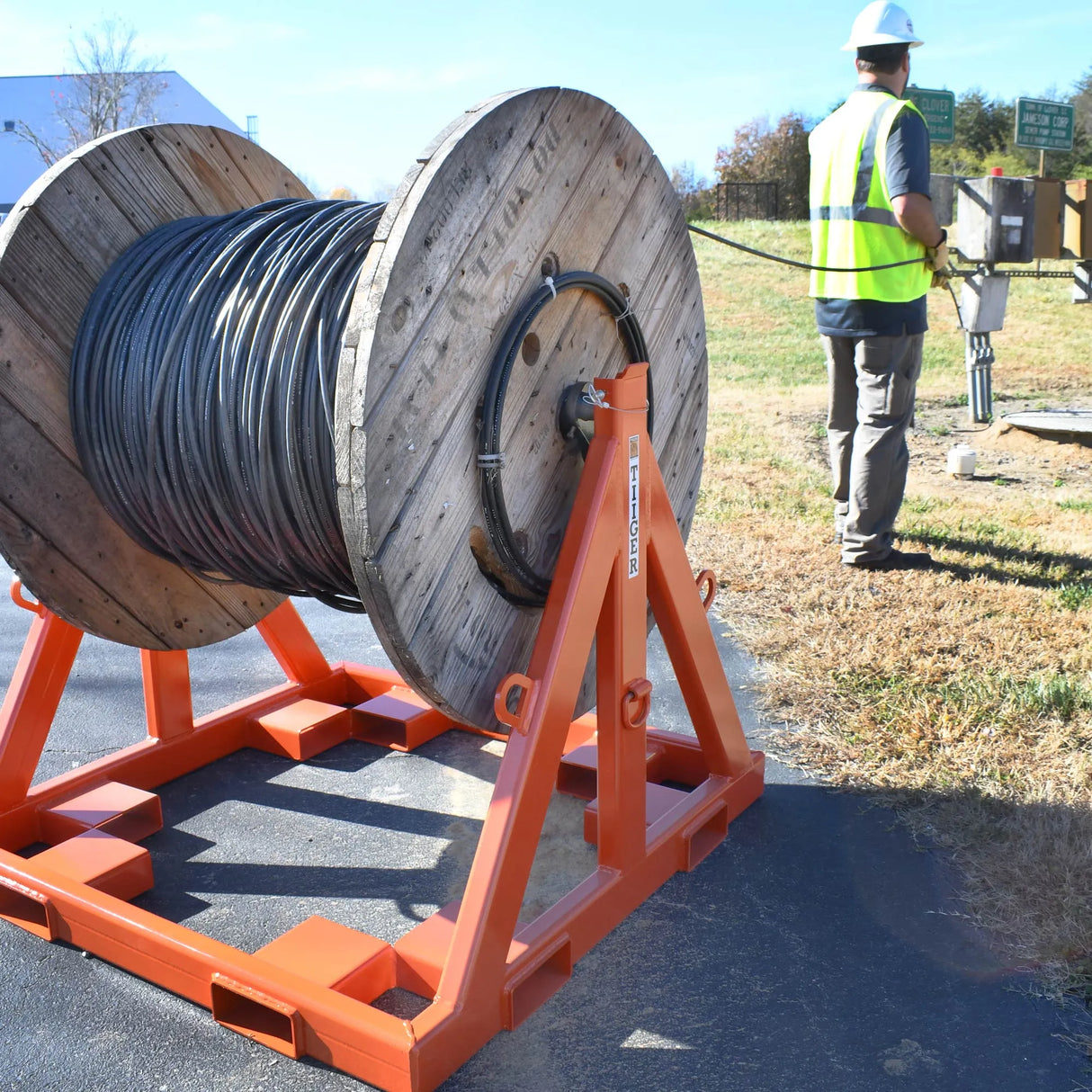 TiiGER LNG-2025 Load-N-Go reel rack holding a large cable reel for controlled payout