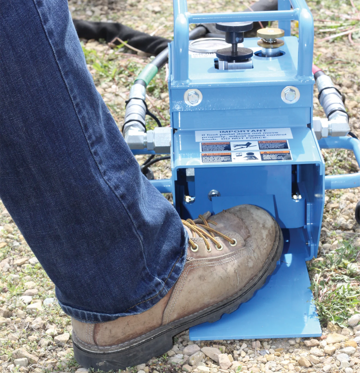 Operator Using Foot Control for Blue Fiber Optic Cable Puller