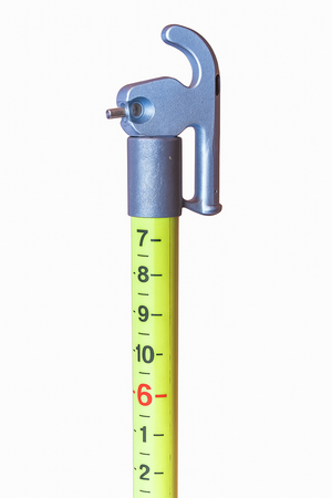 Pentagonal telescoping measuring stick with a 1-1/8 inch top section, featuring clear measurement markings for precise readings.