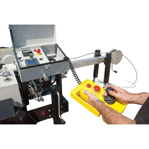 Operator using the APS75 hydraulic cable puller handheld remote control