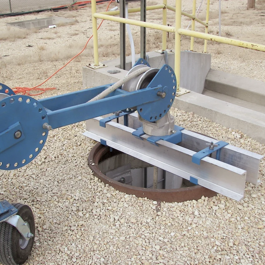 Condux adjustable manhole adapter supporting a CableGlider cable puller above an open manhole