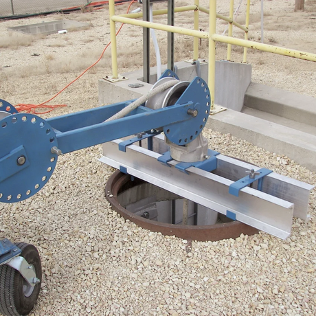 Condux adjustable manhole adapter supporting a CableGlider cable puller above an open manhole