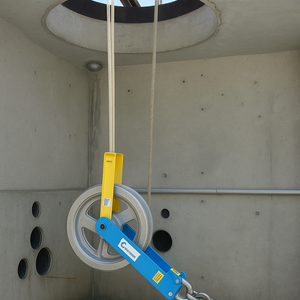 Condux heavy-duty hanger sheave installed in a manhole to guide cable into conduit.